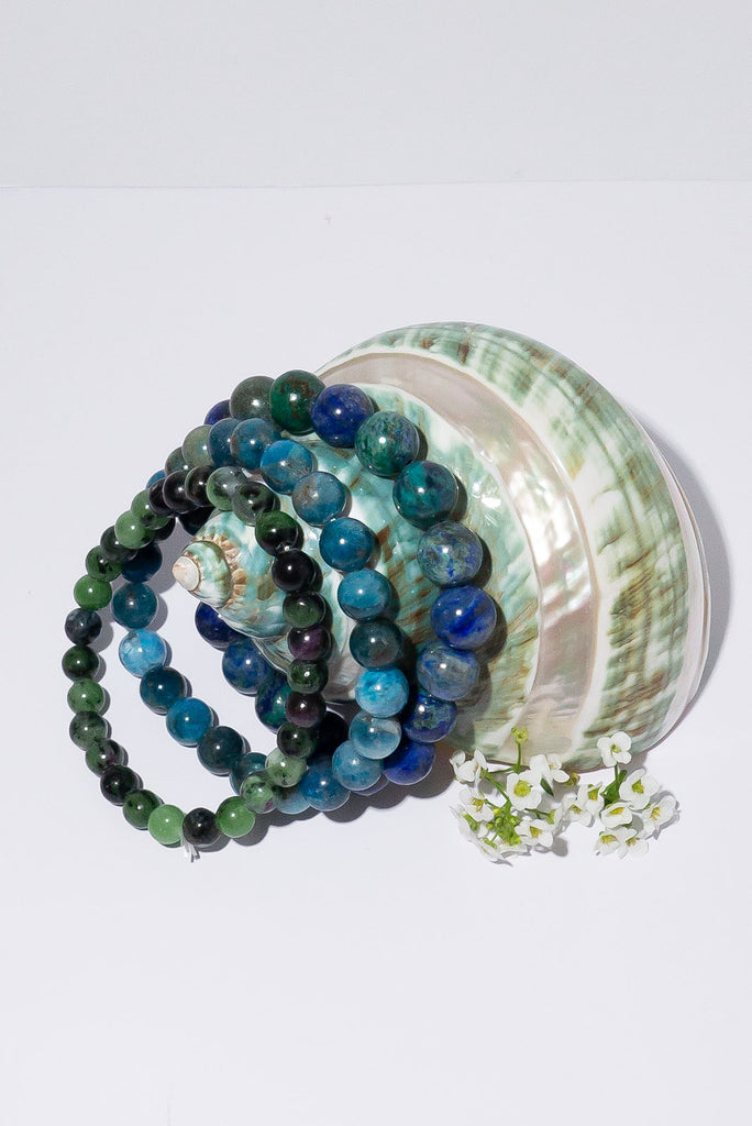 A beautiful trio of stretch bracelets in a tropical jungle.