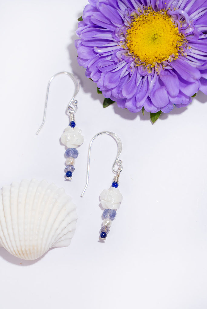 Midnight blue gemstones and a beautiful carved rose in soft white. These delicate gemstone earrings are sure to become a favourite.