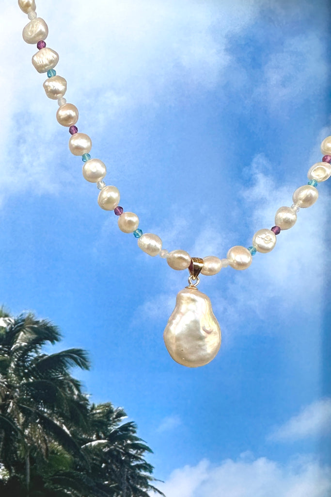 A pearl necklace with a South Pacific twist, luminescent creamy white pearls interspaced with turquoise, pink and white CZ beads, feel the calm of the islands.&nbsp;

Freshwater pearls.