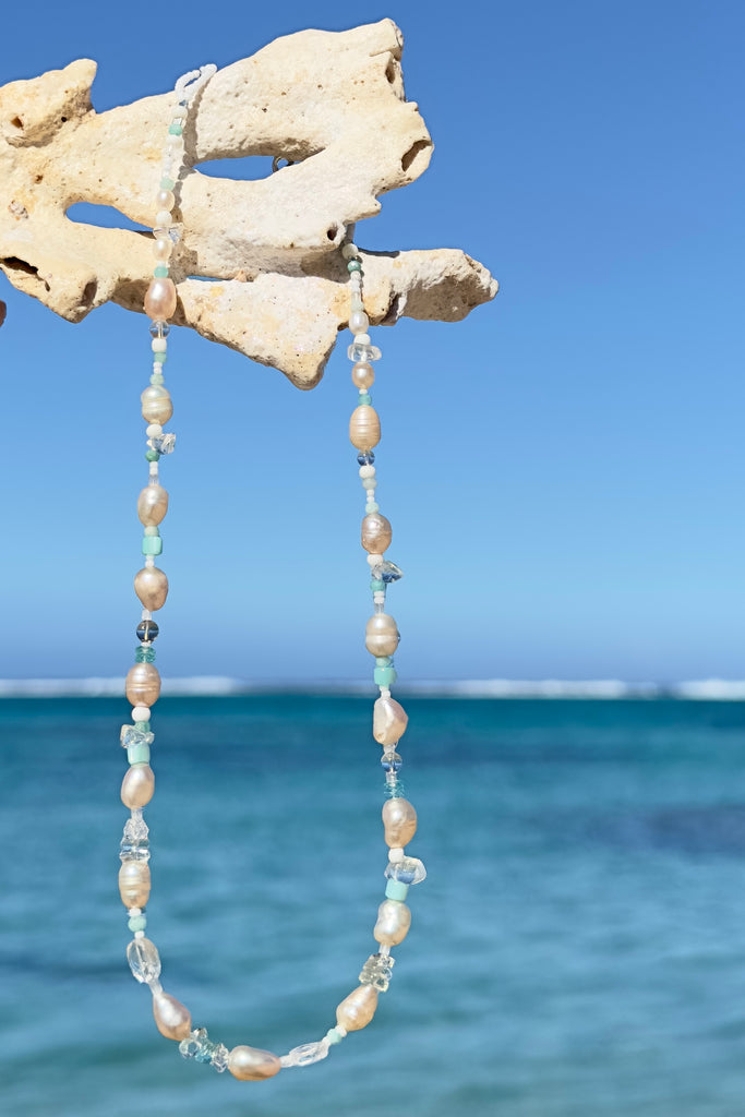 Tiny aqua drops on a tropical island lagoon, luminescent creamy white pearls with wave drops of palest blue Aquamarine and Amazonite beads, feel the calm of the islands.