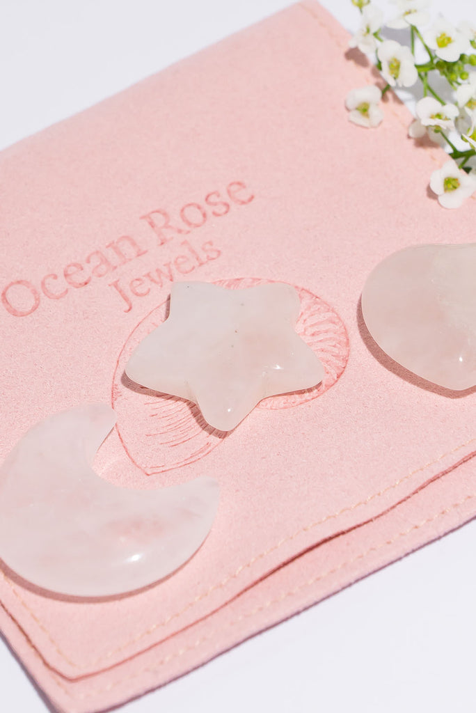 A beautiful trio of carved Rose Quartz talismans.