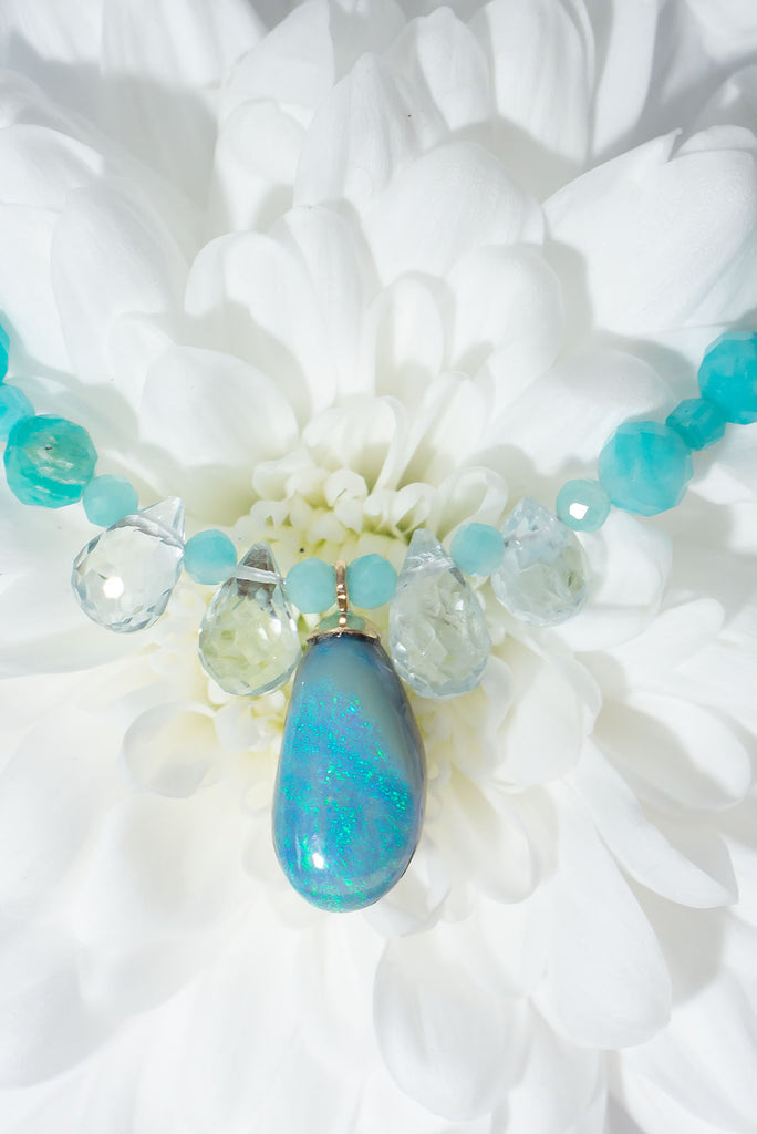 A gentle splash of ocean spray, this lovely Australian opal hangs from a necklace of tiny sparkling Amazonite beads with pale Aquamarine briolette stones as a highlight.