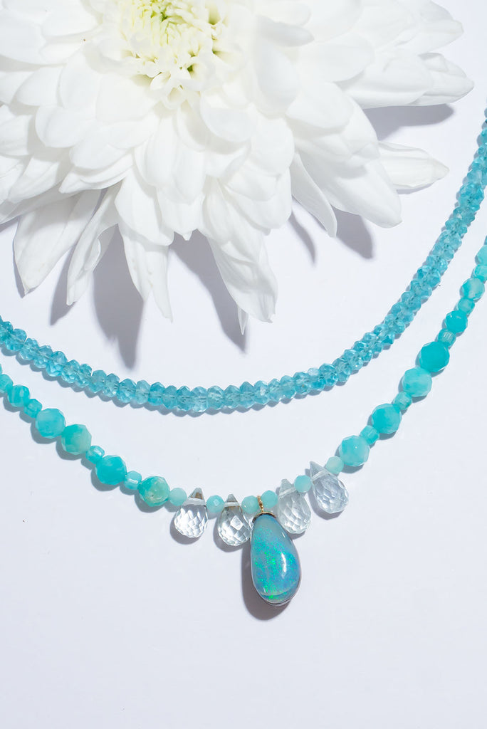 A gentle splash of ocean spray, this lovely Australian opal hangs from a necklace of tiny sparkling Amazonite beads with pale Aquamarine briolette stones as a highlight.