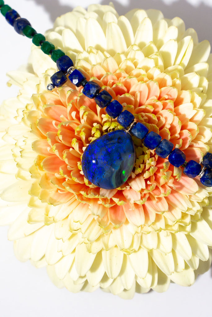 Get lost in the swirling indigo hues of this enchanting necklace.