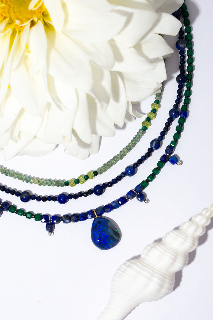 Get lost in the swirling indigo hues of this enchanting necklace.