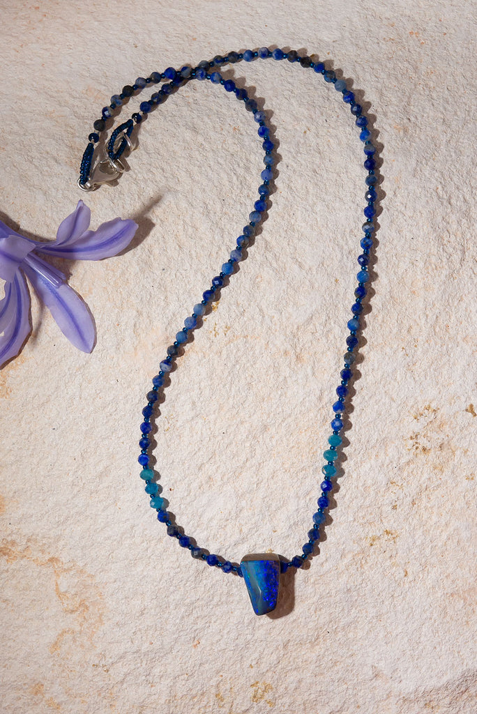 Deep sea blues and aqua sea greens sparkle within this stunning opal & gemstone necklace.