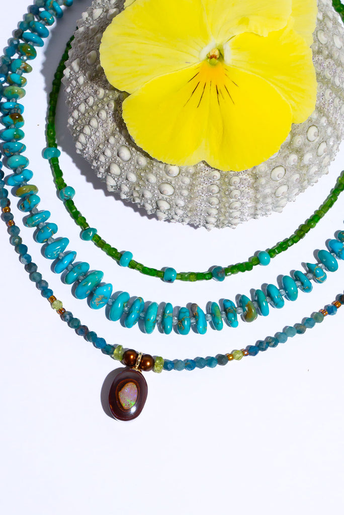 Like the desert coming to life during the rainy season this enchanting necklace features beautiful earthy tones and the warm toned greens of Summer.