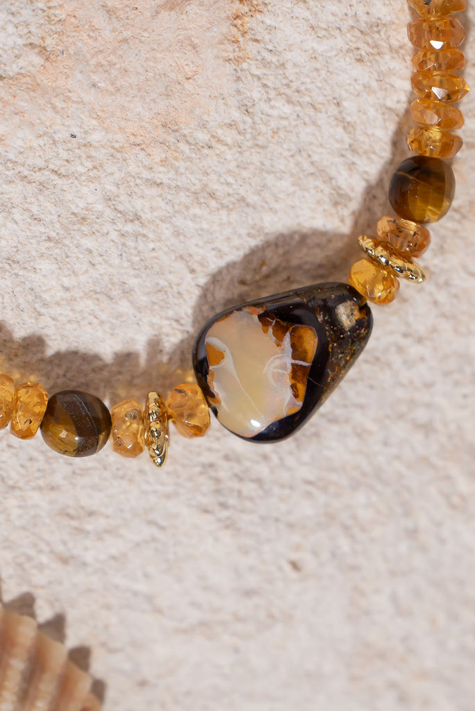 This radiant gemstone &amp; opal bead necklace features saturated golden hues and a unique boulder opal feature bead.