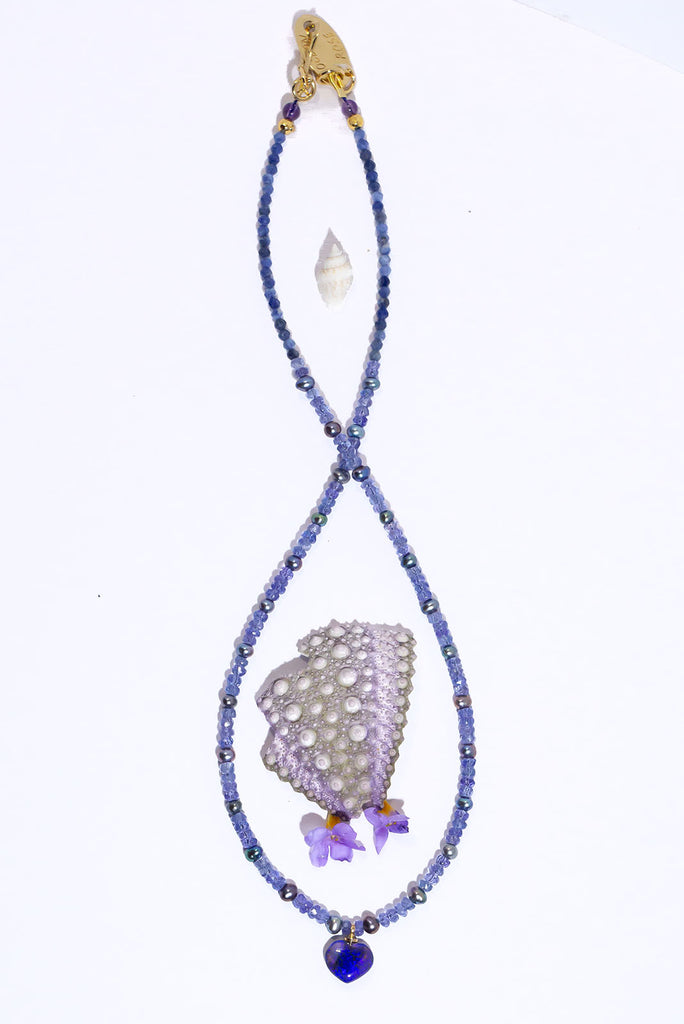 With a swirl of deep blue and dark purple colour flash in a beautiful Lightning Ridge Opal heart pendant you are sure to fall in love with our Necklace Gemstone Andromeda Mystery Love.