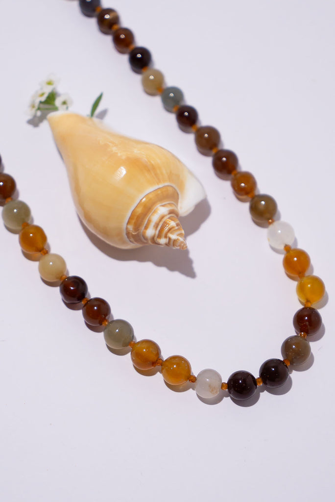 A beautiful mix of natural tones this beautiful chic necklace is perfect for warming up your next outfit.