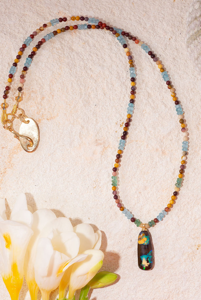 Reminiscent of images of earth from space this gemstone & opal necklace will have you enthralled.