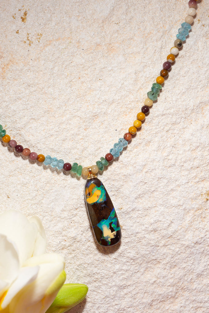 Reminiscent of images of earth from space this gemstone & opal necklace will have you enthralled.