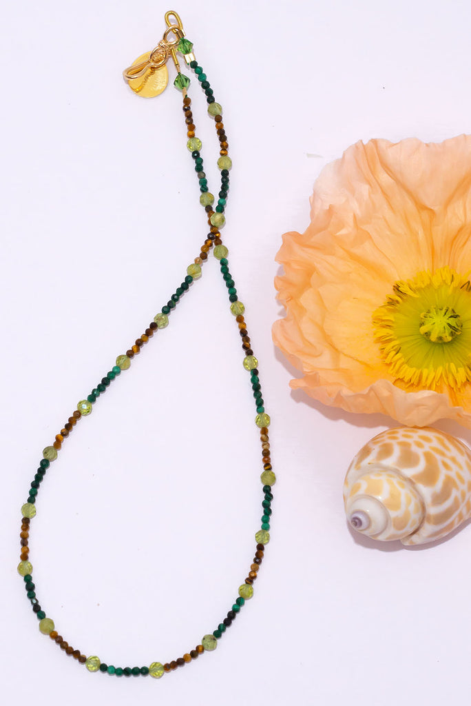 This delicate gemstone necklace features forest green, leafy green and earthy browns.