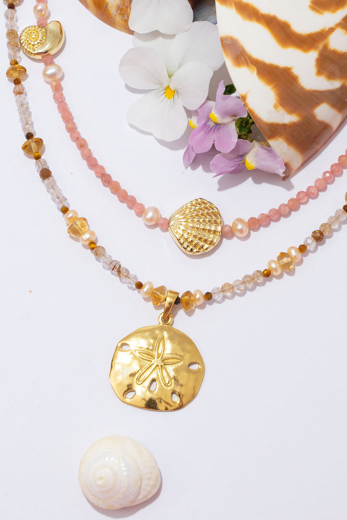 A perfect golden sand dollar set amongst sparkling golden rutile. This is a gorgeous & glowing Summer necklace.