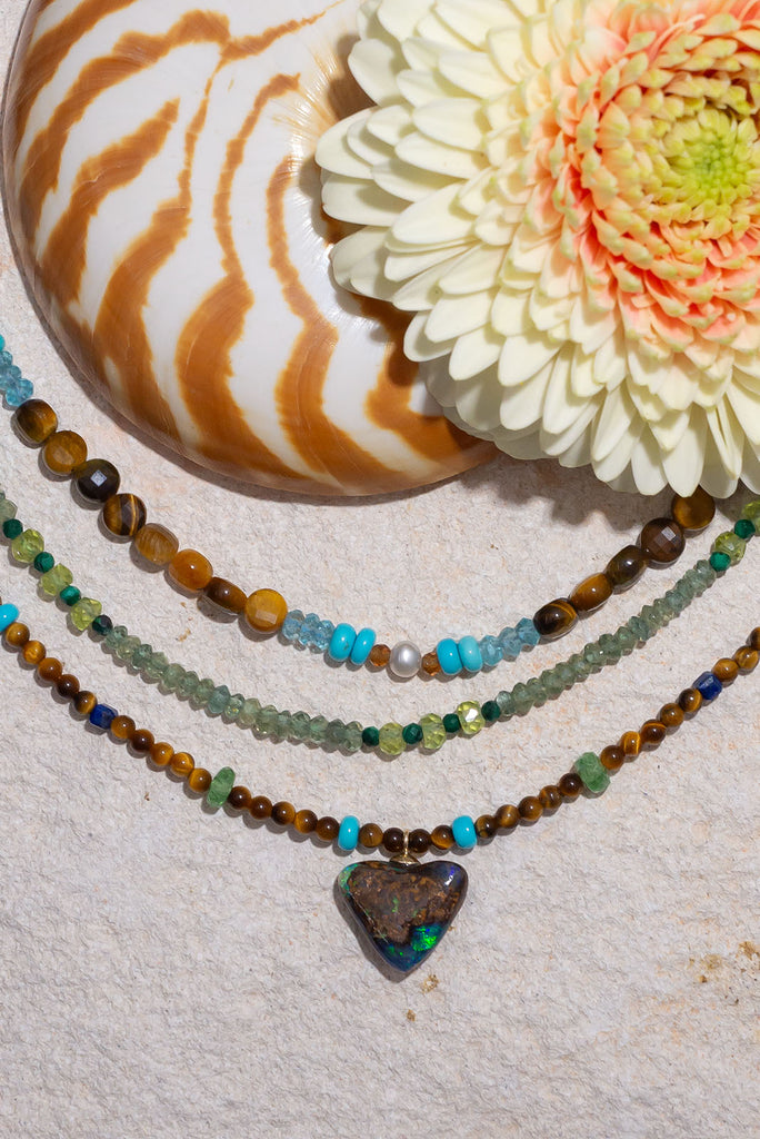 With shimmering greens, sky blues and deep rich brown this gorgeous necklace is inspired by the colour of the forest.