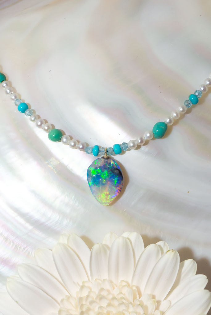 This gorgeous jewel tones necklace features an enchanting solid Australian boulder opal pendant.