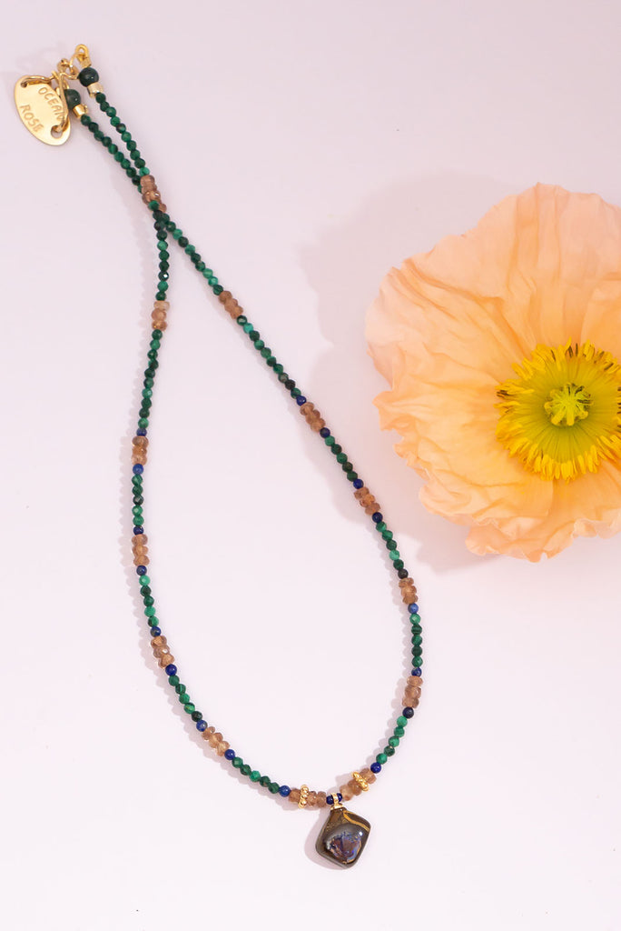 Like a relic from a world lost to the jungle this beautiful necklace will enchant you with its magic.