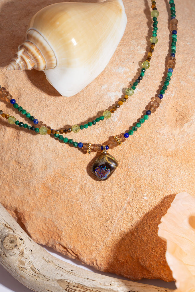 Like a relic from a world lost to the jungle this beautiful necklace will enchant you with its magic.