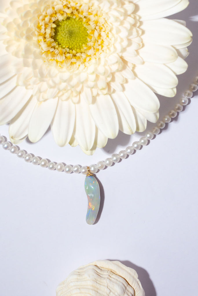 Discover a rainbow of colour within this gorgeous snowy necklace.