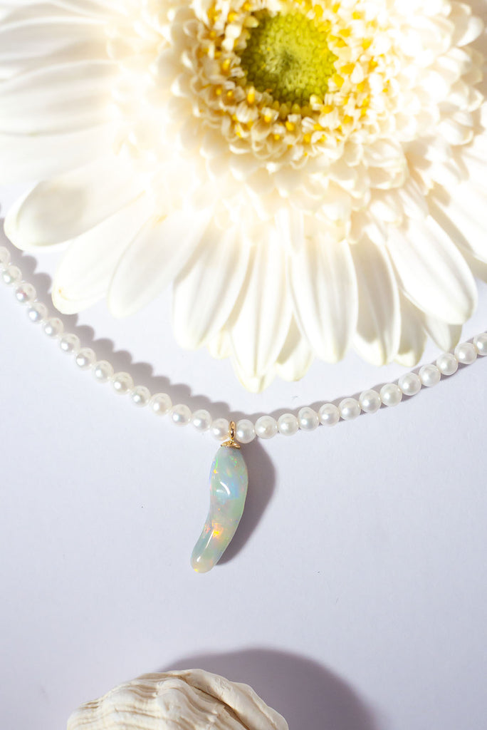 Discover a rainbow of colour within this gorgeous snowy necklace.