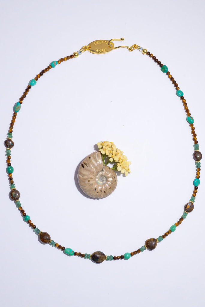 Featuring one of a kind Australian boulder opal beads this magical gemstone necklace was inspired by the beautiful desert palm oasis.