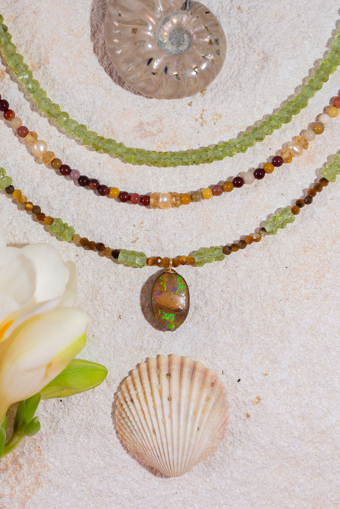 Soft & warm our Necklace Gemstone Rainforest Sunlight is inspired by the warm dappled sunlight as it filters through the leaf green foliage of a tropical rainforest.