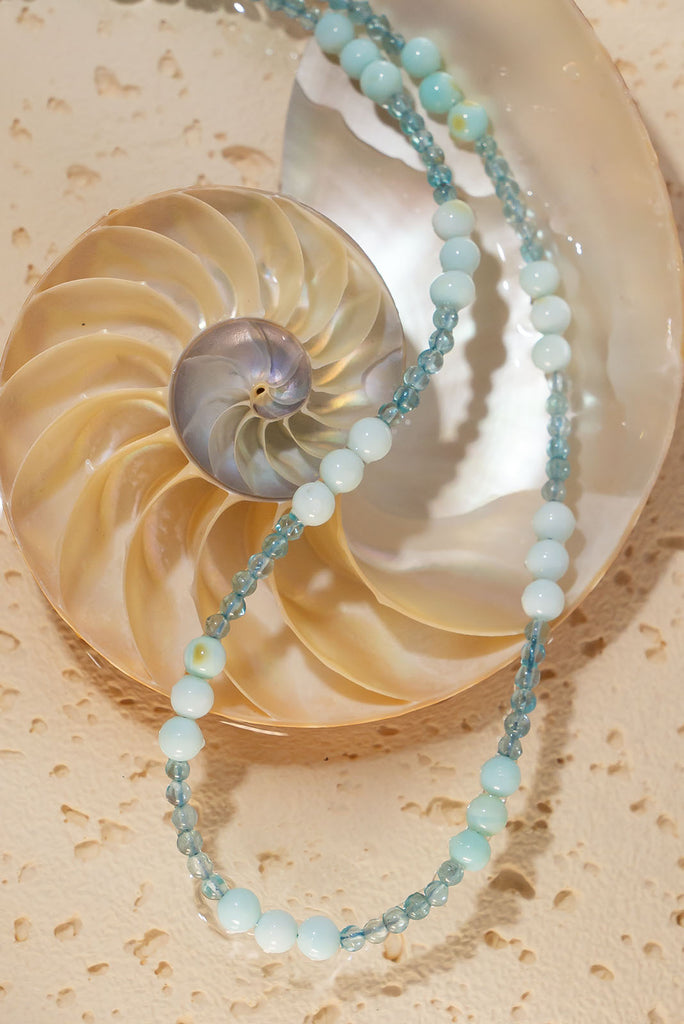 Drift away to a tropical island with our soft sea colour Necklace Gemstone Reef Bubbles.