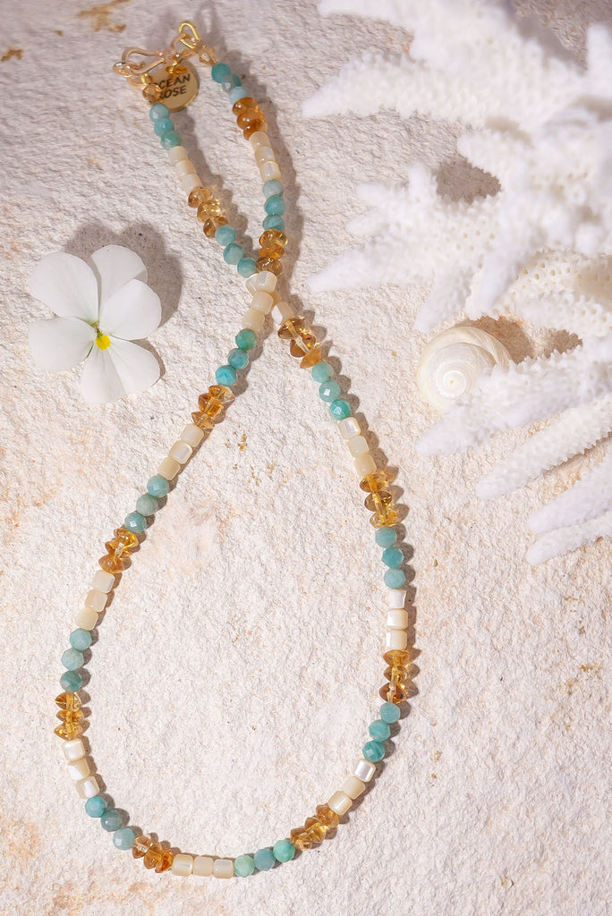 This necklace will have you dreaming of soft sea breezes, warm golden sands and cool aqua waters.