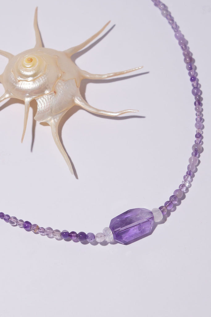 This beautiful necklaces features delicate amethyst beads in a range of purple shades.