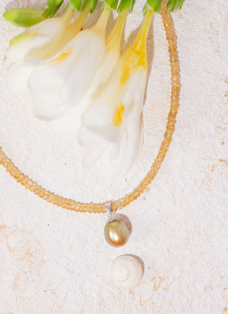 Like the sunshine after the rain this radiant necklace shimmers, shines & sparkles.