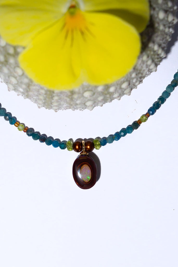 Like the desert coming to life during the rainy season this enchanting necklace features beautiful earthy tones and the warm toned greens of Summer.