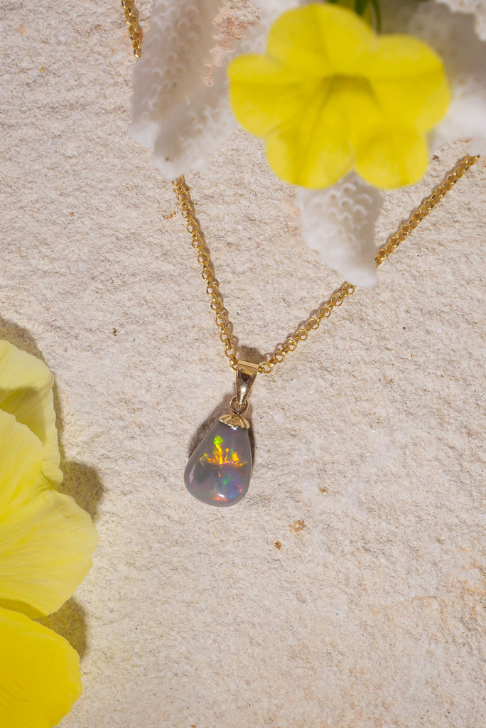 The little sister of our beautiful Pendant Australian Opal Soul Fire this gorgeous piece was cut from the same stone. With a strong flash of red and yellow across the front this stone dances with colour in the sunlight.