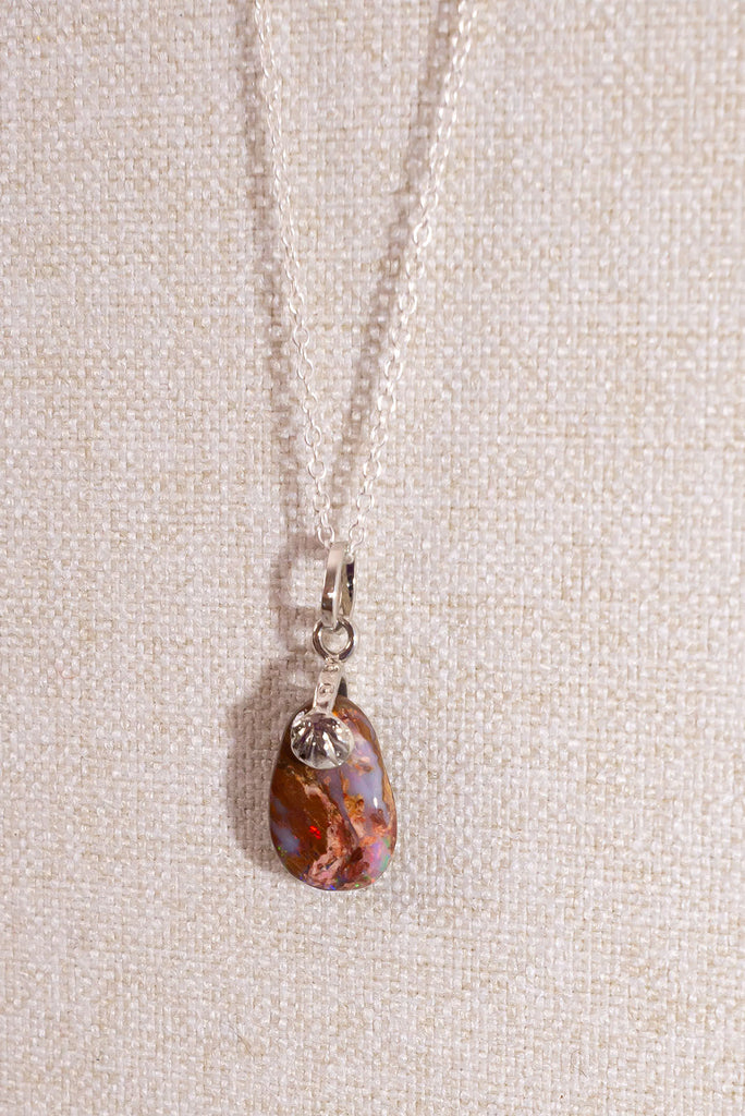 Discover the beauty of Australian Boulder Opal with this delicate pendant.