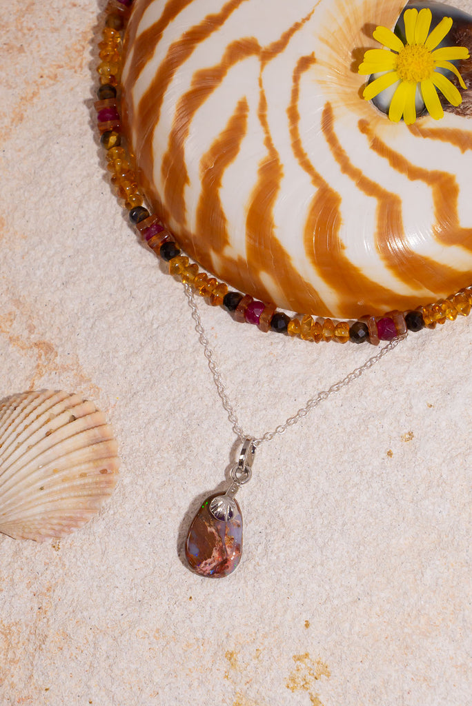 Discover the beauty of Australian Boulder Opal with this delicate pendant.