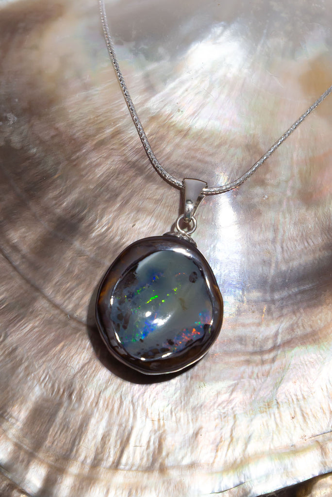 Discover a shimmering rainbow of colours in this magical Australian Boulder Opal piece.