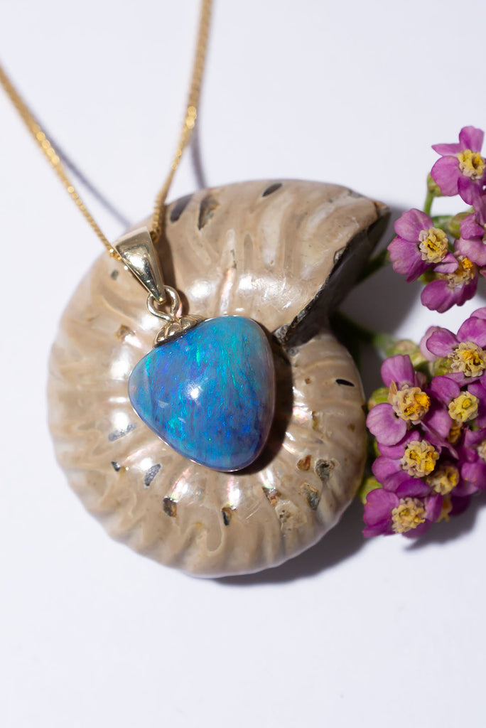 This beautiful solid Australian opal heart seems lit from within. With a beautiful soft glowing blue fire this piece is sure to steal your heart.