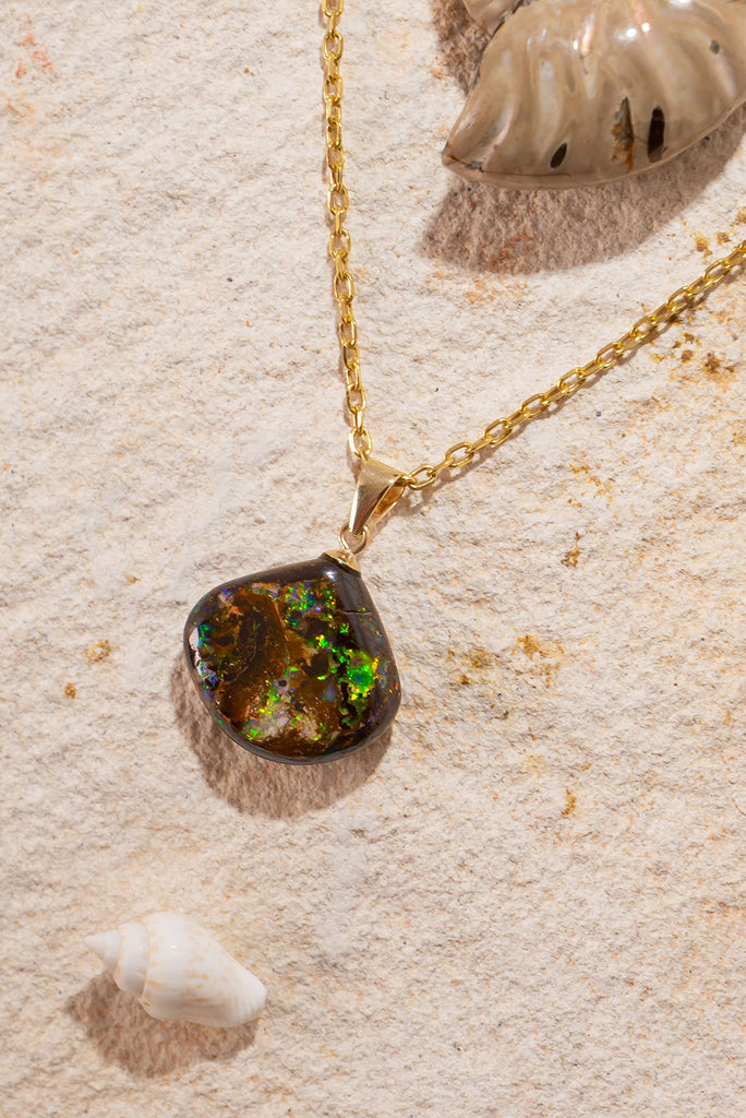 A beautiful statement piece with striking green & gold flashes this Australia boulder opal are truly eye catching.