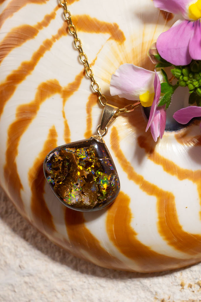 A beautiful statement piece with striking green & gold flashes this Australia boulder opal are truly eye catching.