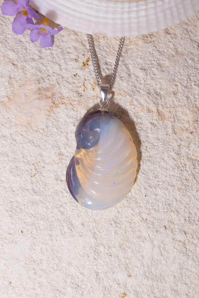 Not just a seashell from the seashore, this magical nautilus pendant is carved in solid Australia opal. This unique one of a kind piece was carved in Noosa, Queensland from locally sourced opal rough.