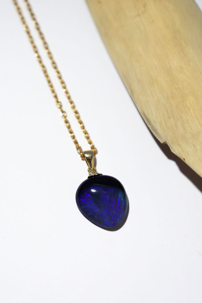 A shimmering swirl of midnight blue, deepest purple and misty mauve can be found in this mesmerising Australian Black Opal pendant.