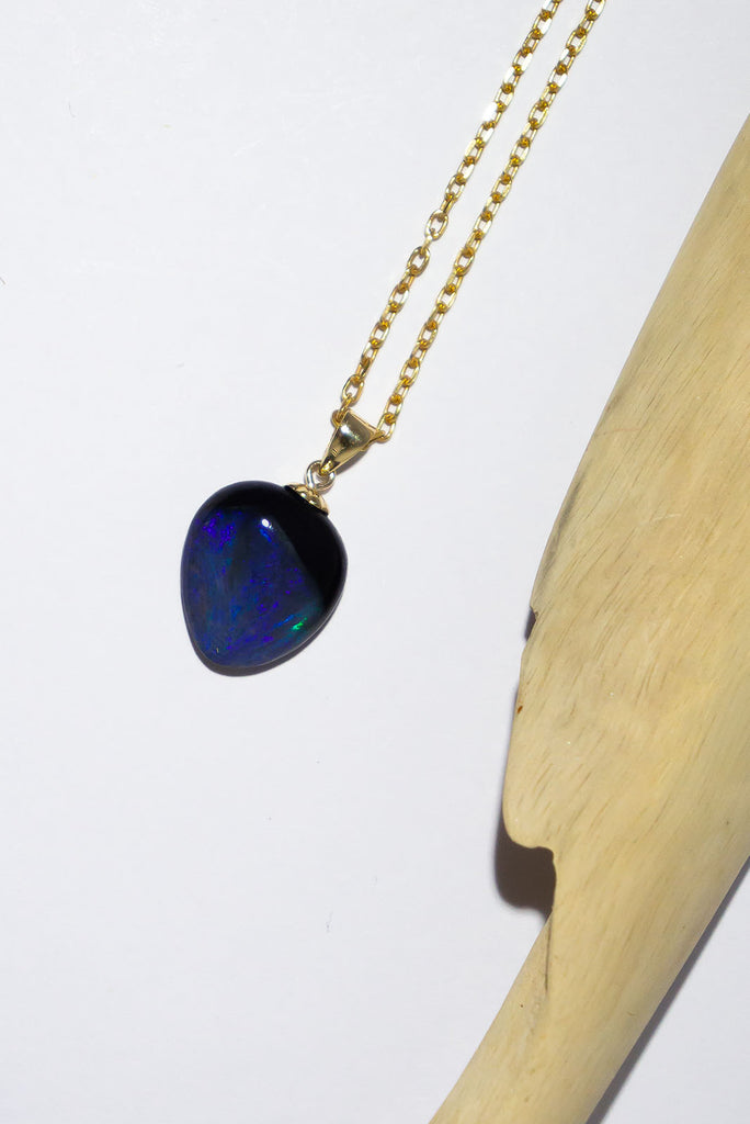 A shimmering swirl of midnight blue, deepest purple and misty mauve can be found in this mesmerising Australian Black Opal pendant.