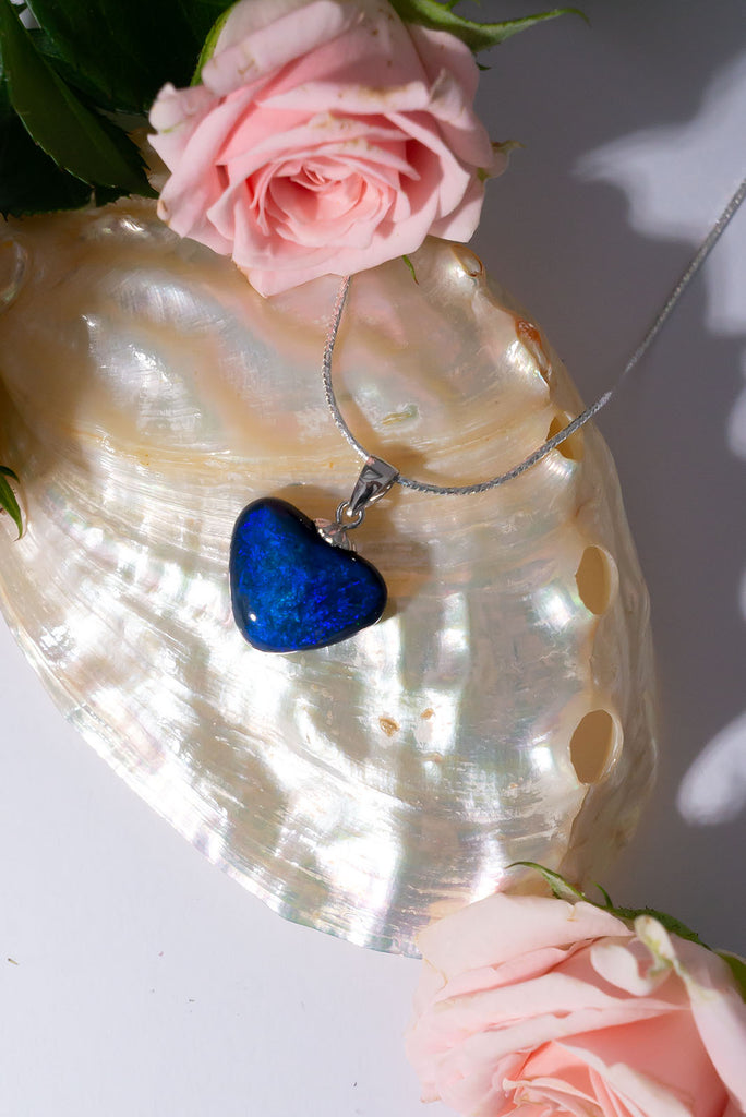 The deepest ocean of love, this heart shaped opal has swirls of bright cobalt blue with a touch of teal.