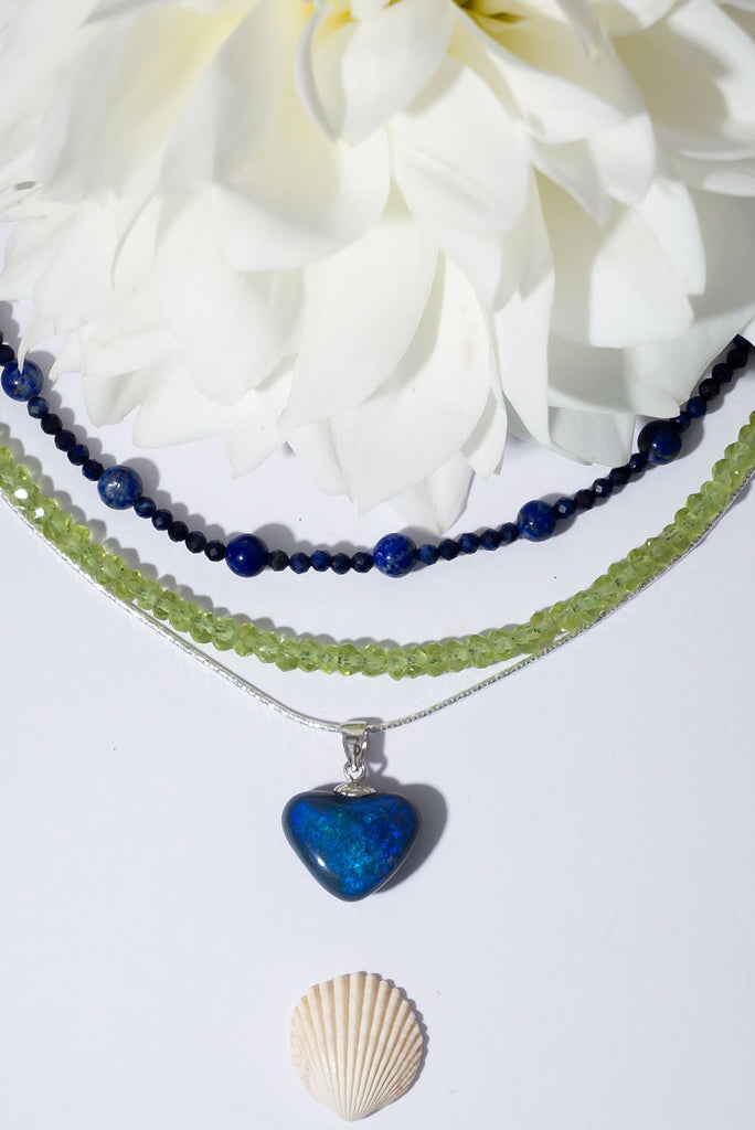 The deepest ocean of love, this heart shaped opal has swirls of bright cobalt blue with a touch of teal.