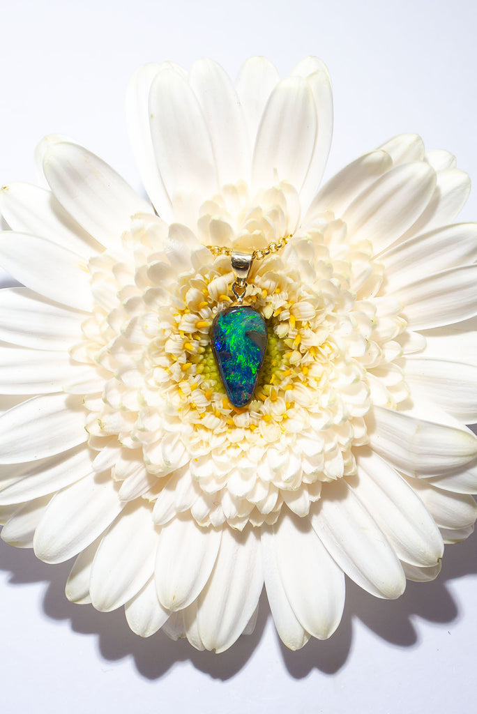 A swirling reef of sea green and blue sparkling opal fire. This beautiful solid Australian Opal pendant is an enchanting and eye catching piece.