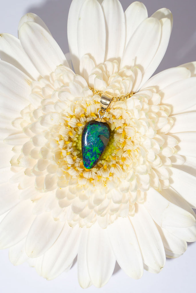 A swirling reef of sea green and blue sparkling opal fire. This beautiful solid Australian Opal pendant is an enchanting and eye catching piece.