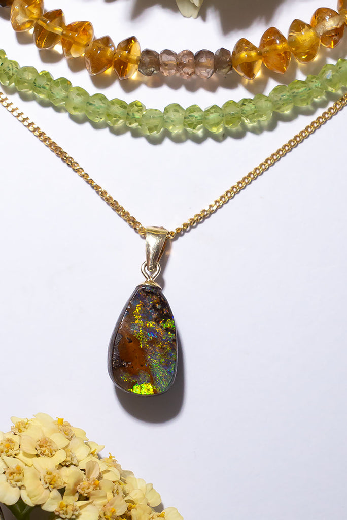 A beautiful statement piece with striking flashes in different shades of green, this Australia boulder opal is reminiscent of African plains after a rainstorm.