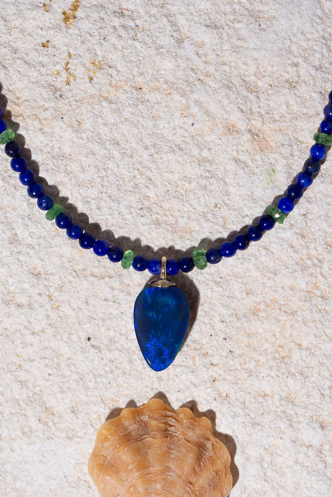 Intense jewels tones & an enthralling black opal make this piece something special.